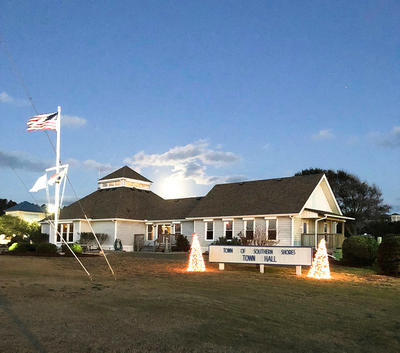 Town Hall with Christmas trees in front yard